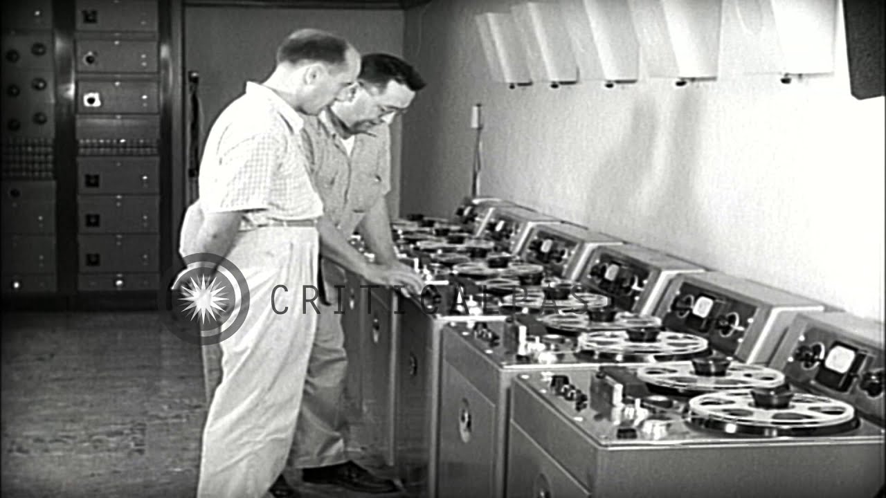 Mr Blackburn explains VOA relay operations to Mr Jan Hadjukiewiez in Okinawa HD Stock Footage