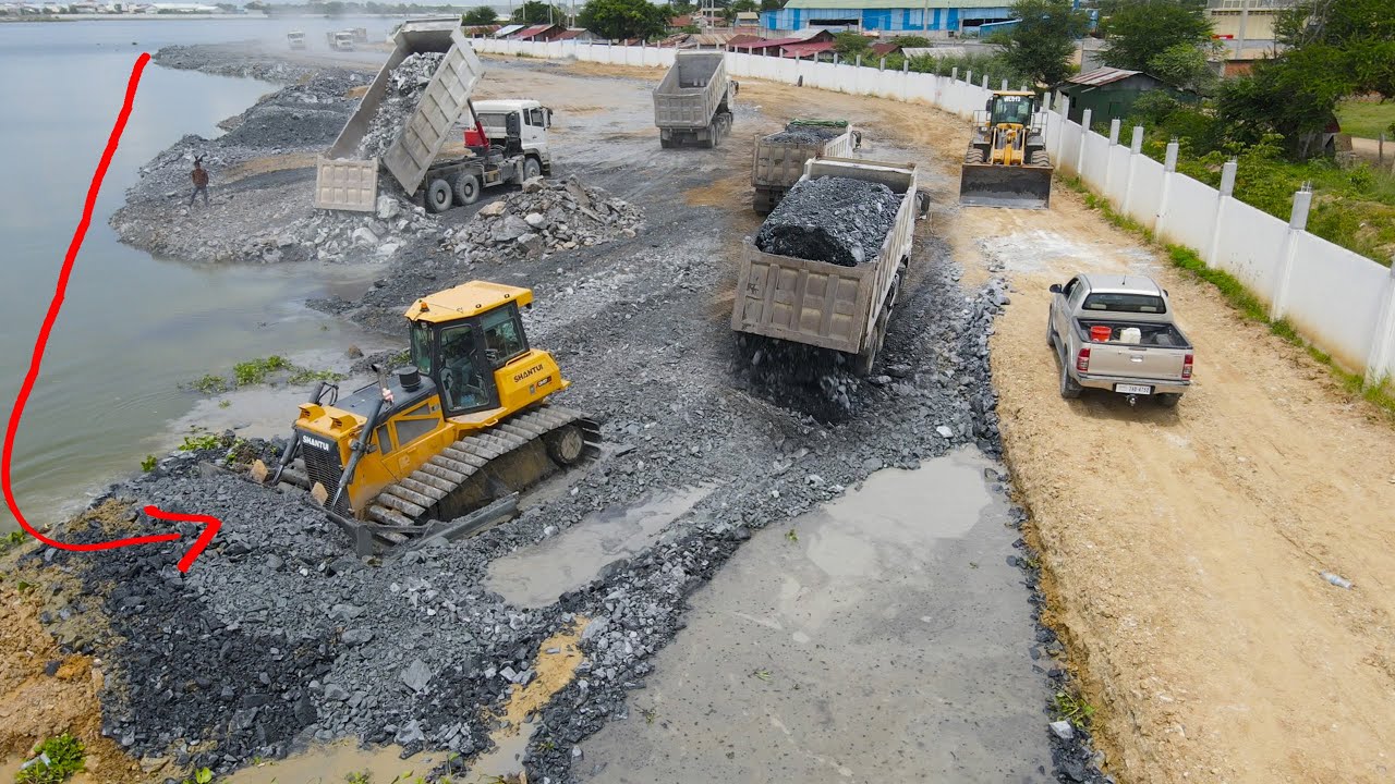 Really Excellent Mighty Power Bulldozer and Dump Truck Operation Push, Moving Stone into Big Lake