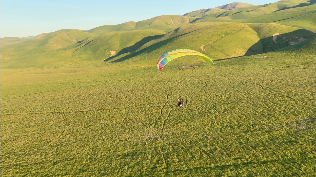 Flying Over Spectacular Grassy Mountains