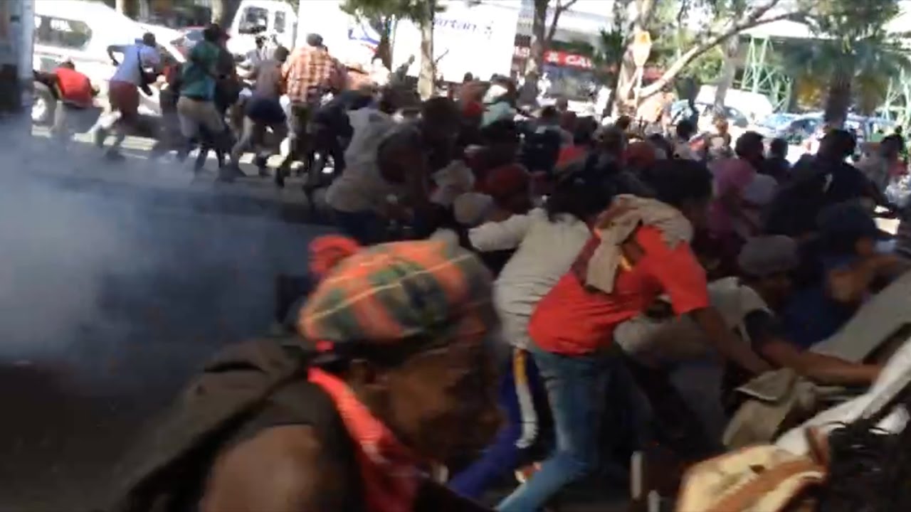 Police fire stun grenades to disperse protesters at Cape Town taxi rank