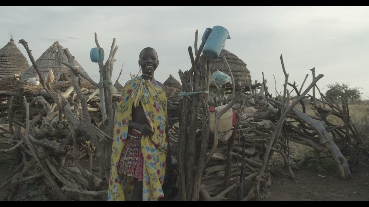 Toposa tribe young woman in traditional clothing in a village, Namorunyang, Kapoeta, South Sudan
