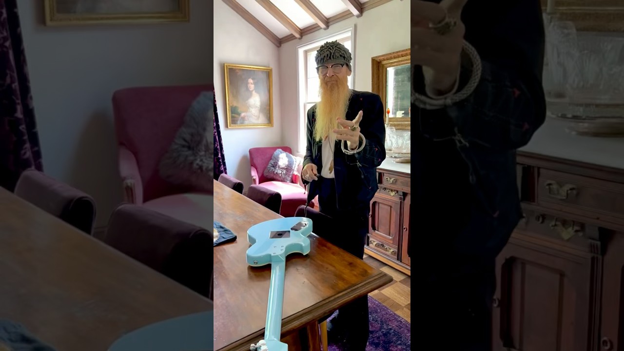Billy F Gibbons signs beard autograph on a NEWMAN Prototype guitar. 