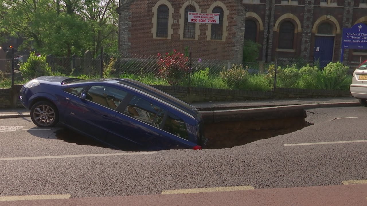 Car falls down huge sinkhole on London road