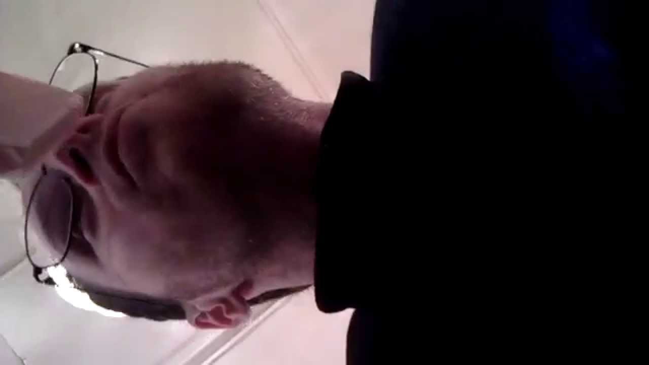 Guy hiccuping uncontrollably in a fancy store; in