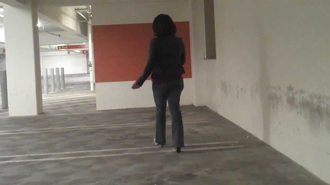 ....Crossdresser in jeans at the parking lot....