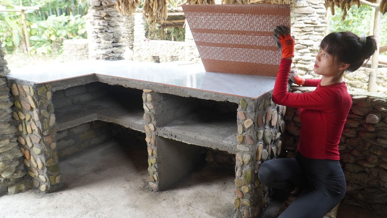 The young woman built a kitchen bricks - Techniques Build Kitchen Cooking Table Traditional
