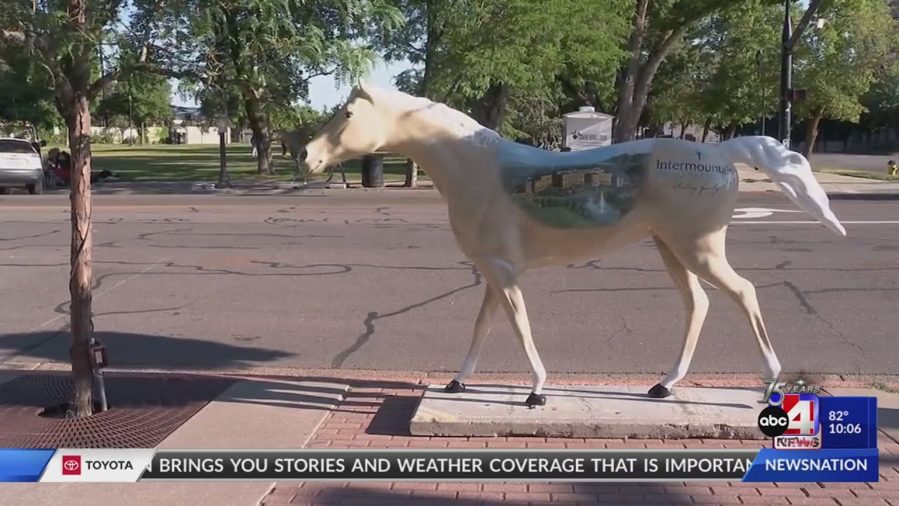 The road leading up to Ogden's pioneer day celebration is lined with horses