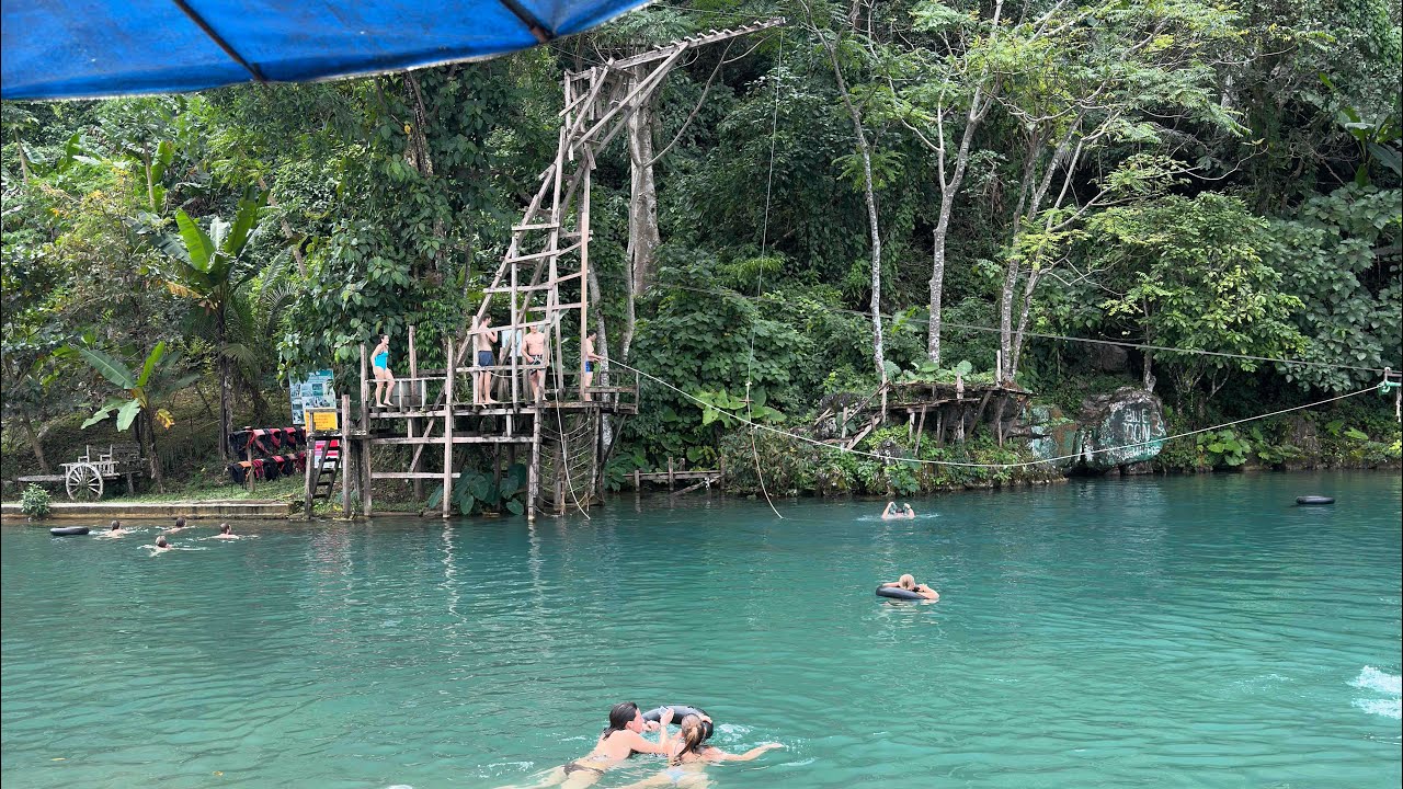 Day 23 & 24: Luang Prabang to Vang Vieng - chaotic train journey, blue lagoons & cave exploring 🧭