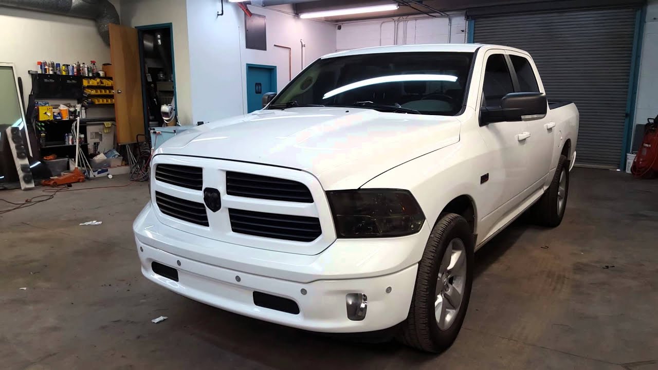 DODGE RAM VINYL WRAP BUMPERS, GRILL AND DOOR HANDLES. BLACK OUT HEADLIGHTS AND TAIL LIGHTS
