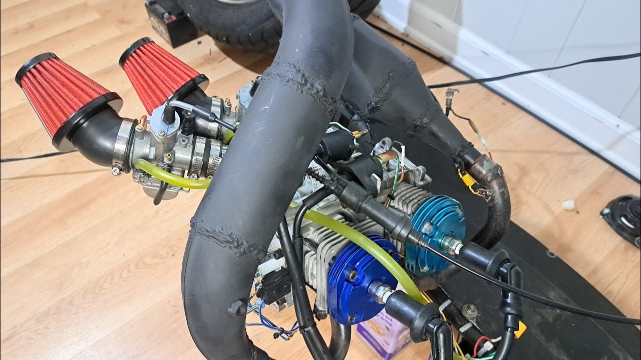 Homemade twin cylinder 2 stroke engine assembly. 100cc twin cylinder powered razor scooter.