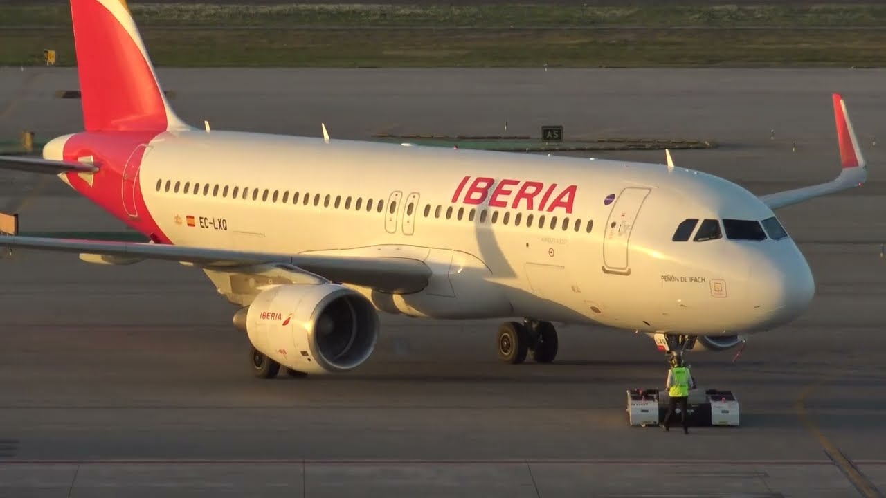 Iberia Airbus 320 EC-LXQ on pushback at Barcelona LEBL