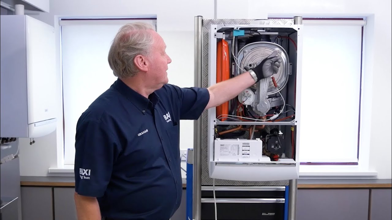 The correct procedure for refitting the combustion assembly on Baxi's stainless steel heat exchanger