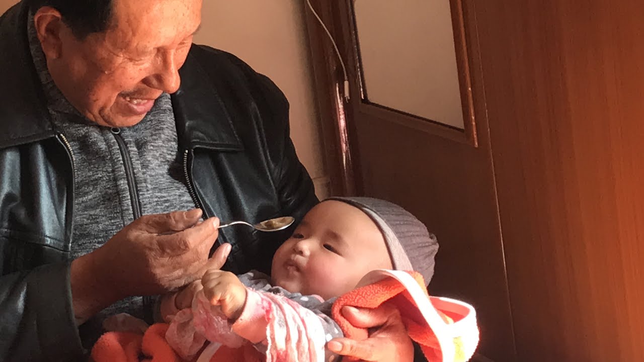 Mehmeh (Grandpa) feeding lunch to his Second (Choh) Grandson …though a bit late