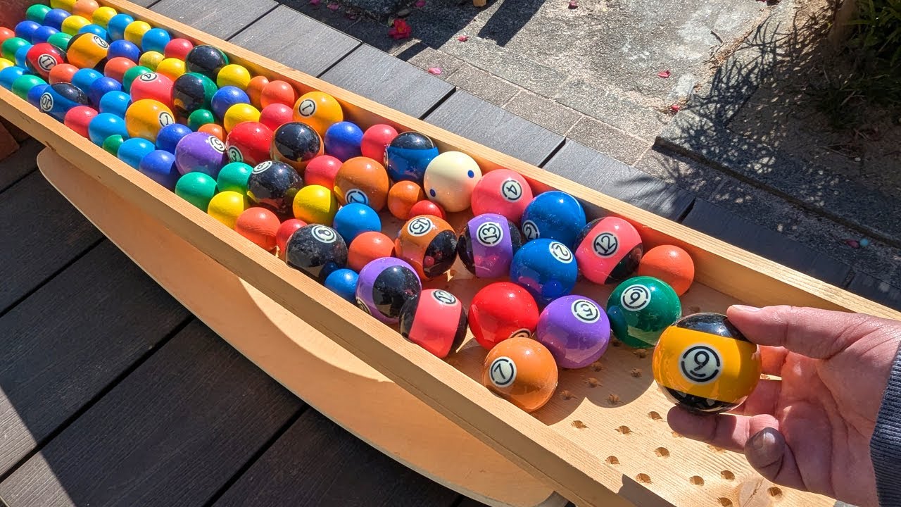 Marble run race. Wooden seesaw handmade course