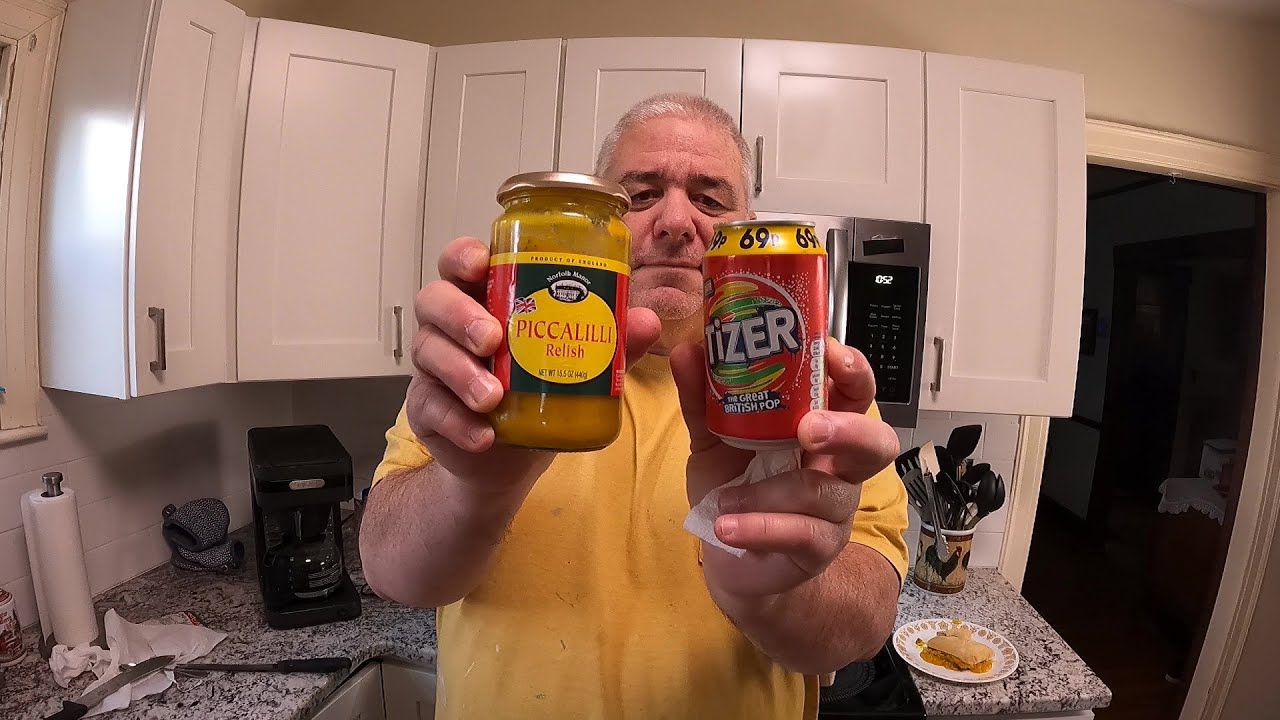 Eating Piccalilli and drinking Tizer for the first time.