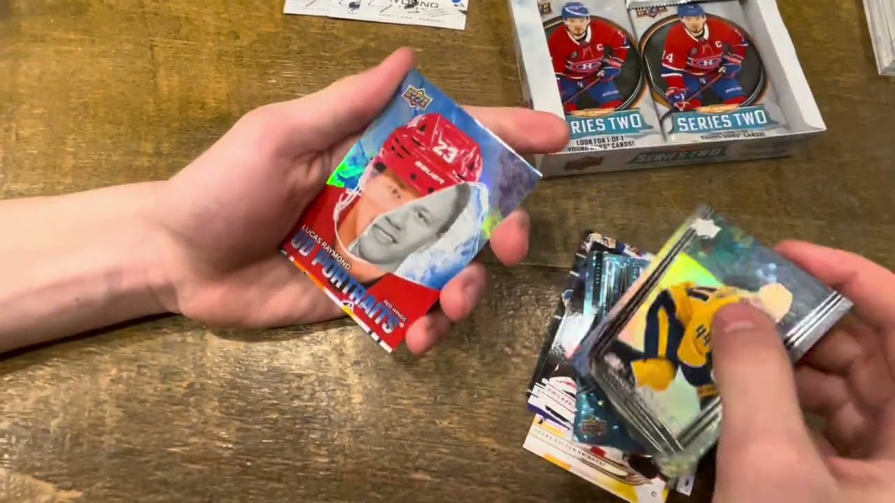 Opening a box of 2025-26 Upper Deck Series 2 Hockey with my son.  Trying to pull the Schaefer YG