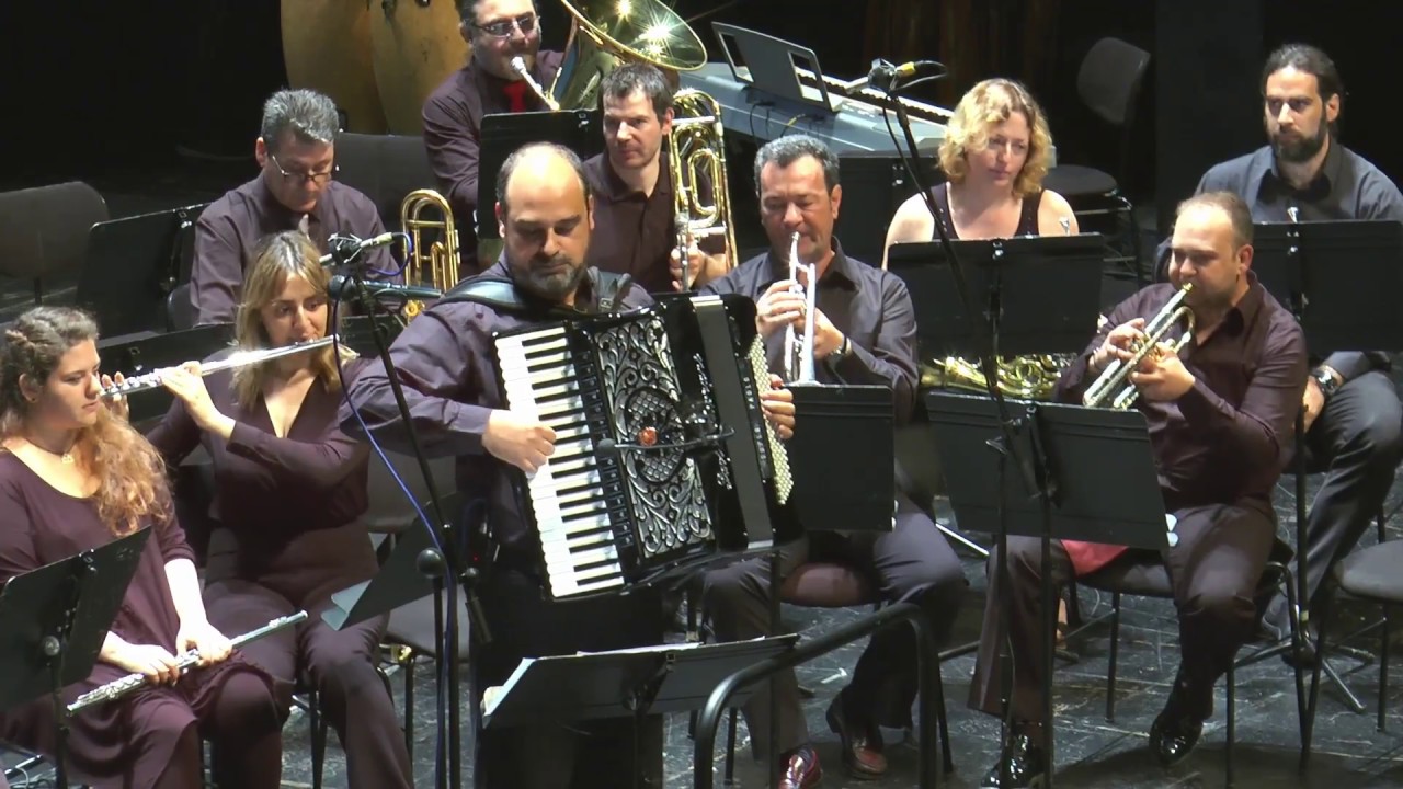 &Eta; Banda del Sol &sigma;&tau;&omicron; 9&omicron; &Delta;&iota;&epsilon;&theta;&nu;έ&sigmaf; &Phi;&epsilon;&sigma;&tau;&iota;&beta;ά&lambda; &Phi;&iota;&lambda;&alpha;&rho;&mu;&omicron;&nu;&iota;&kappa;ώ&nu; &Chi;&omicron;&rho;&omega;&delta;&iota;ώ&nu; &Omicron;&rho;&chi;&eta;&sigma;&tau;&rho;ώ&nu;