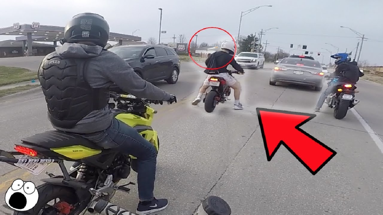 MAN THROWS CIGARETTE AT BIKER!