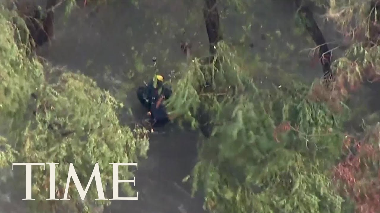 Helicopter Crew Rescues Man During Flash Floods In Los Angeles | TIME