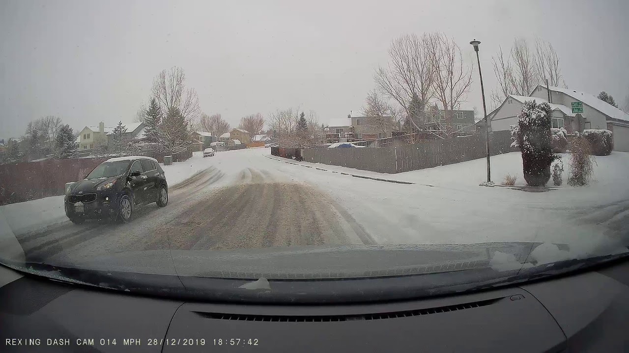Rexing V3 Dashcam Video - Sliding on ice and hit the curb