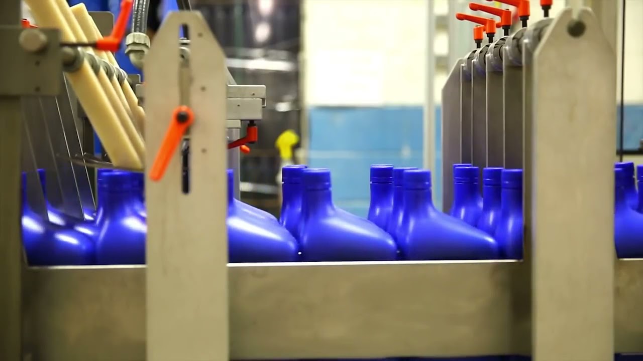 THE QUART LINE - PACKAGING SUNOCO LUBRICANTS QUART BOTTLES