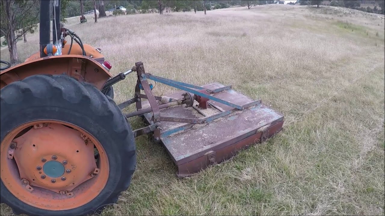 Farm work. Slashing with a Fiat tractor.