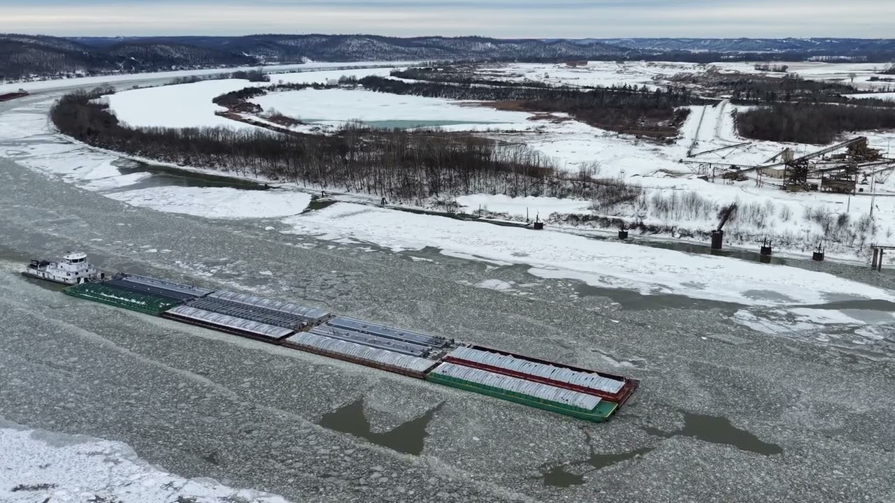 Barge going up the Ohio River through ice