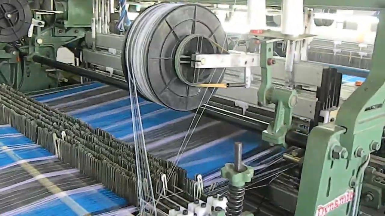 DYNAMIC RAPIER LOOM WITH SIDE TUCK IN DEVICE