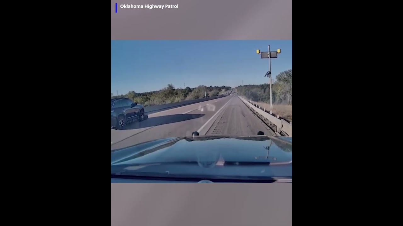 Police dashcam video of 18-wheeler losing multiple tires on the highway