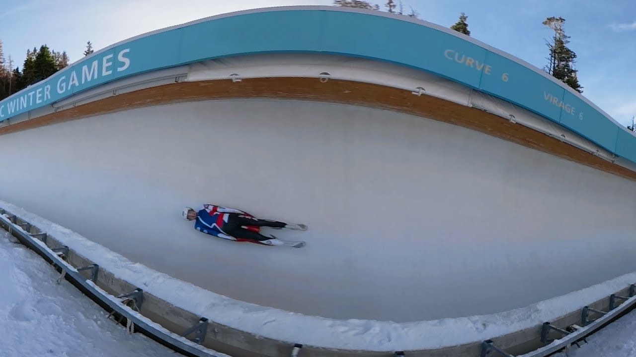 Speed down an ice tunnel on a luge sled in VR