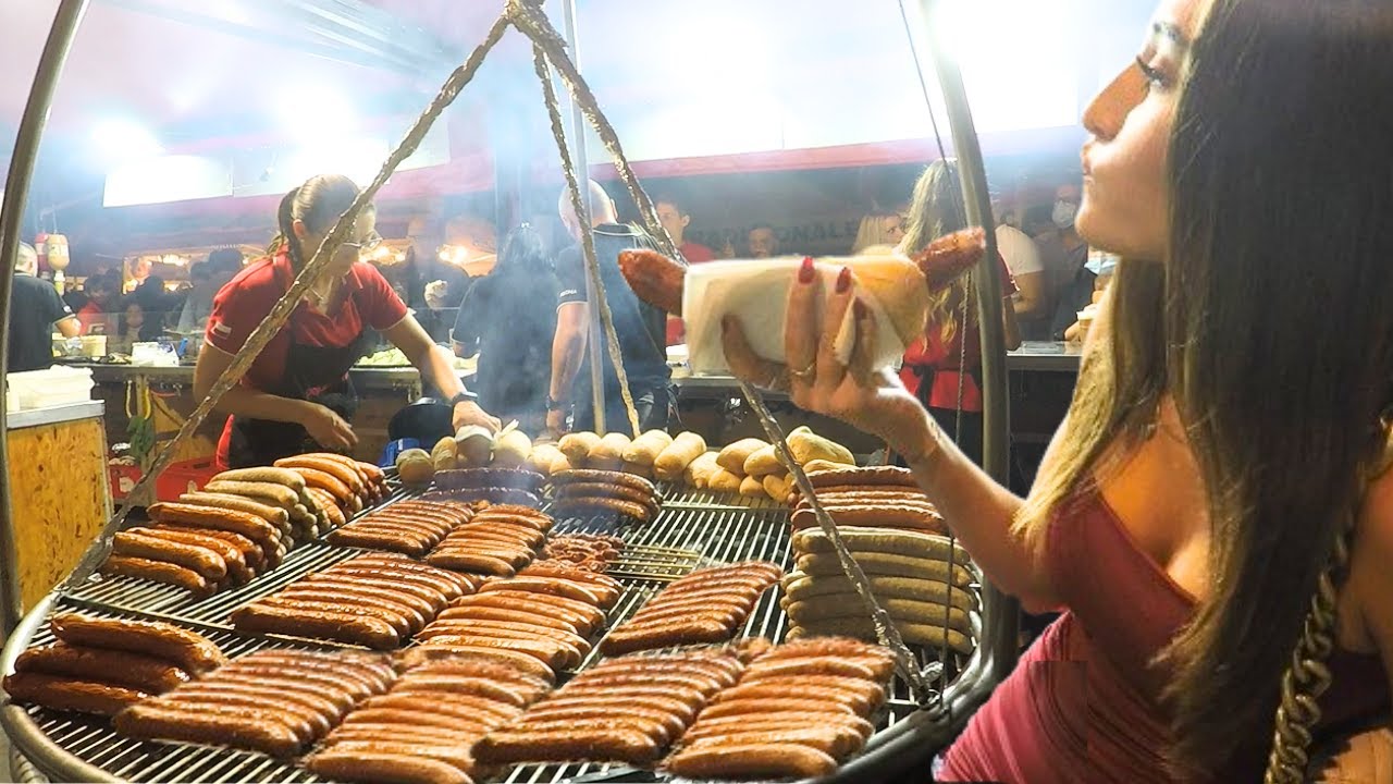 Italy Street Food Fests. Hot Polish Sausages, Bavarian Grilled Meat, Pyramidal Grills of Asado