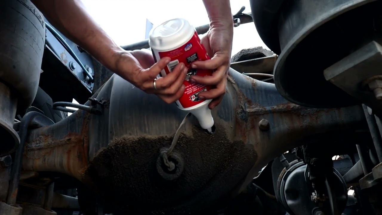 SEMI TRUCK CHECK AND ADD OIL INTO AXLE