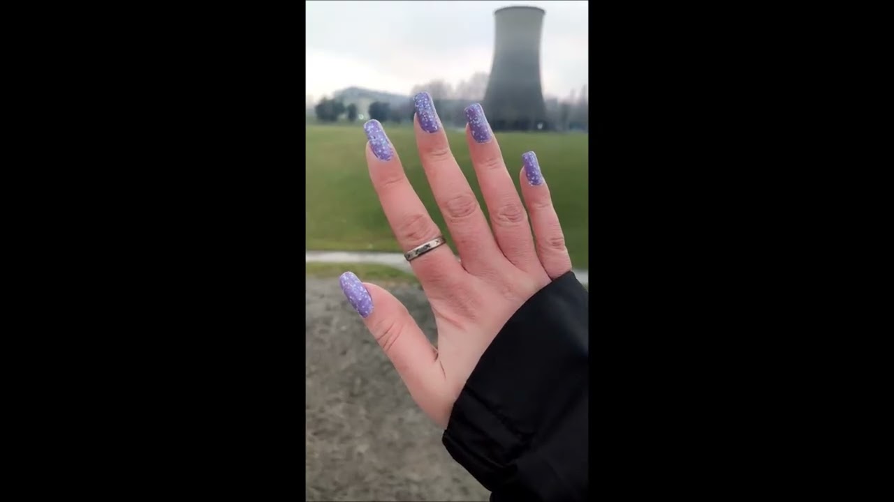 Purple nail art on pretty natural nails by our model Jadez (december 2025)