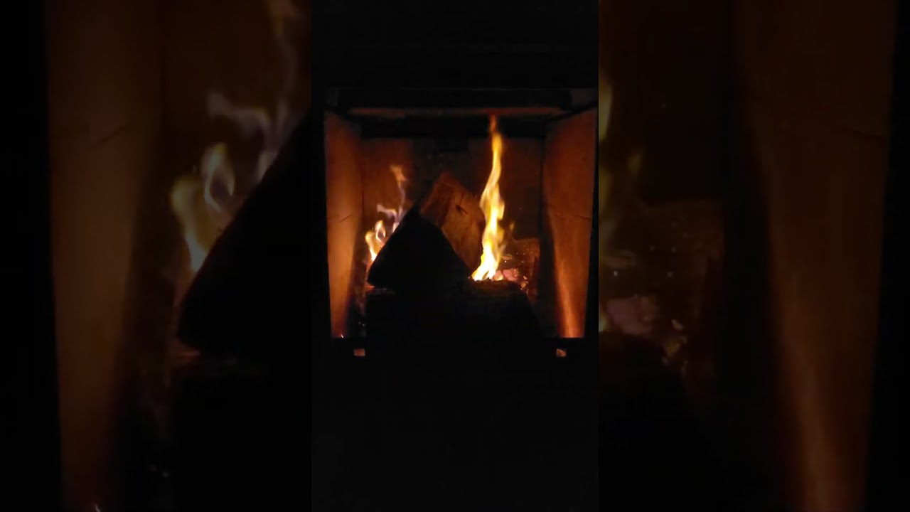 a slow-burning log fire glowing softly