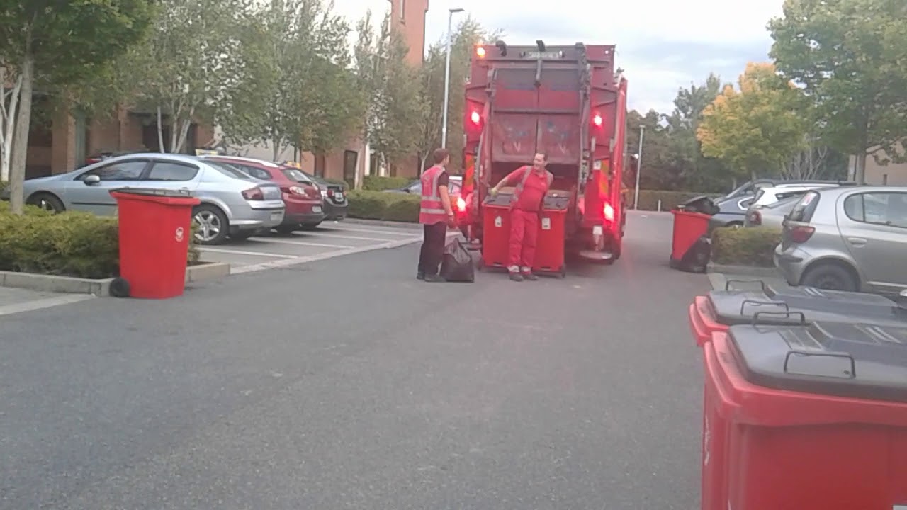 The city bin co black bins collection Denis truck