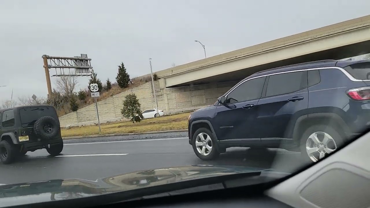 Driving through Atlantic City Suburbs, windmill, swamp land.