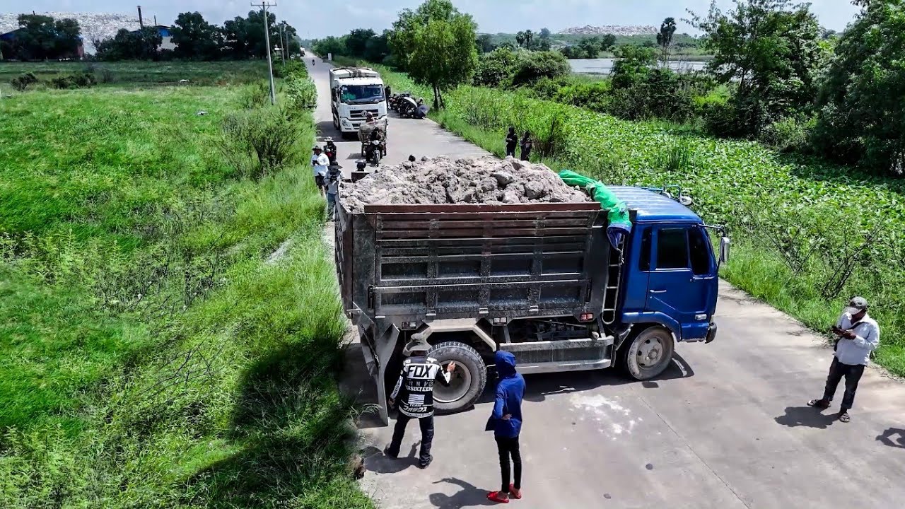 Fantastic Activities Landfill Start project By Best Skill Dozer KOMATSU D31A & Trucks unloading soil