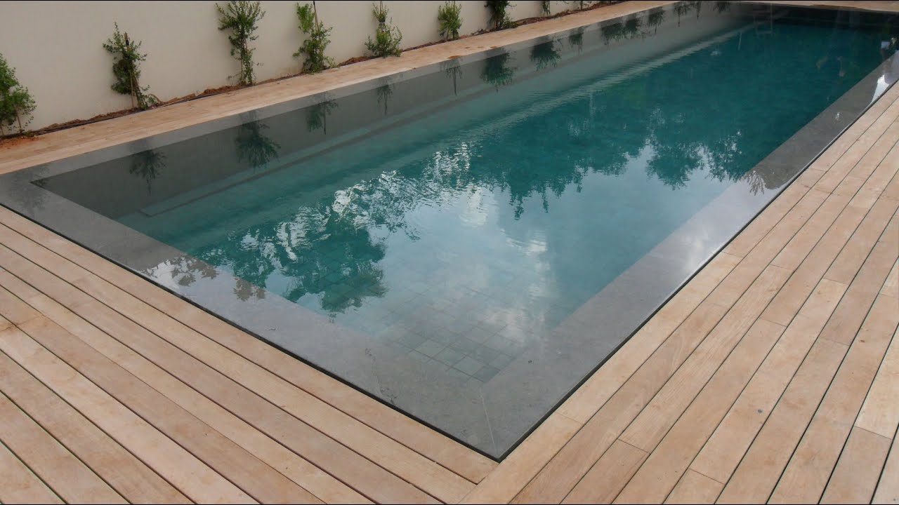 Teak decking installation around swimming pool with hidden fasteners