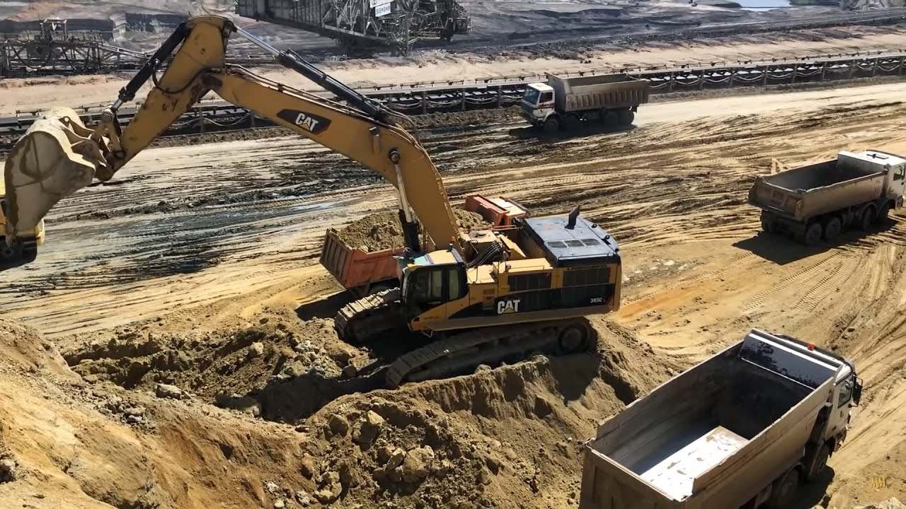 Caterpillar 385CL Excavator Loading Trucks - Kivos Ate