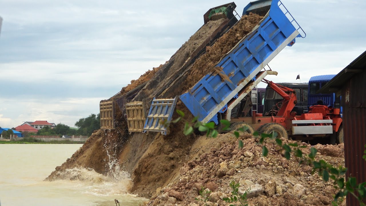 Incredible Dump Truck 10 Wheels Dumping Dirt into Water Filling Land with Power Bulldozer Working