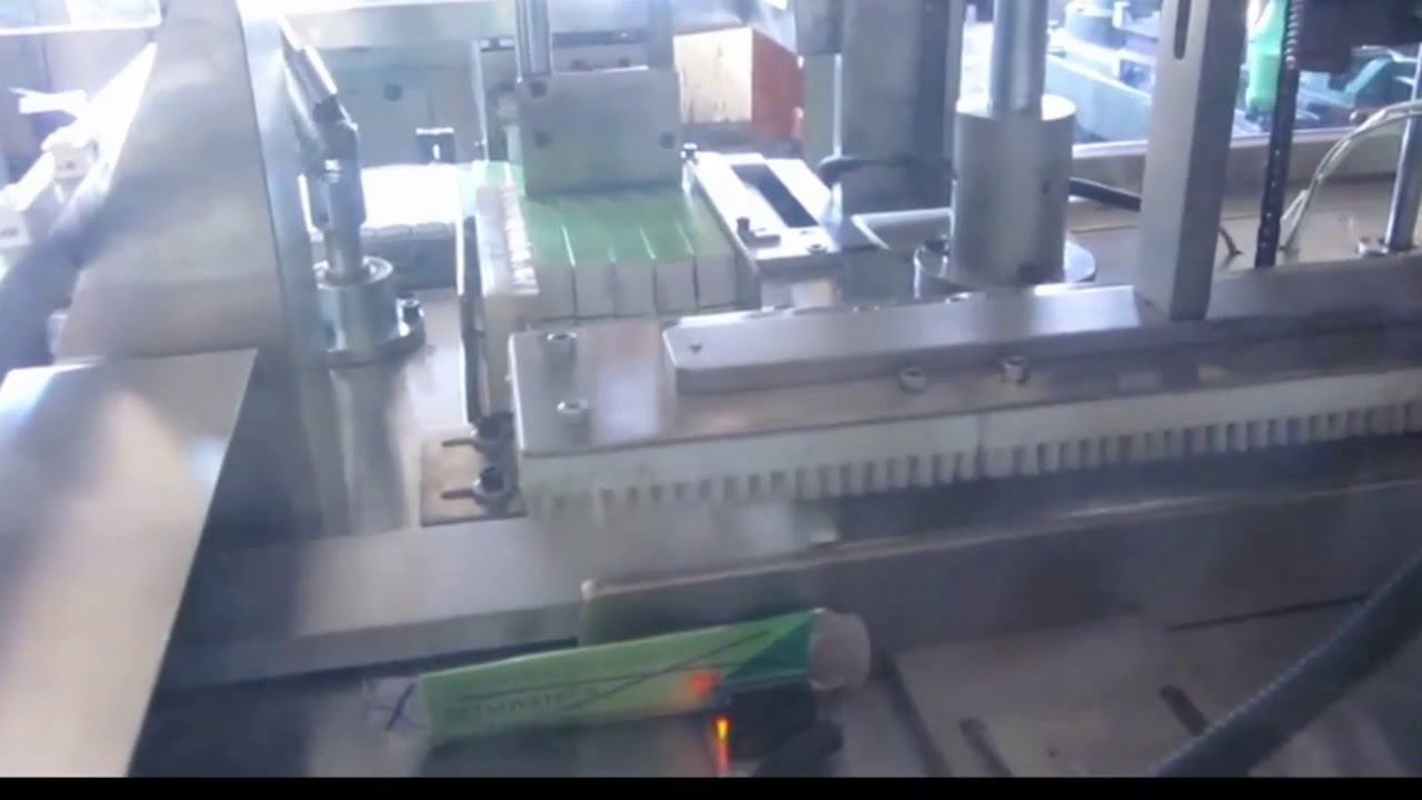 AUTOMATIC TUBE CARTON COLLATING AND BANDING MACHINE