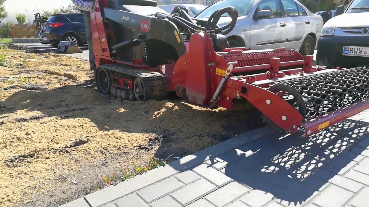 Toro Dingo TX525 Wide Track with soil cultivator attachment