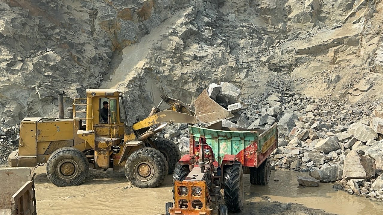 Trolley load up black hard Stone With bigger Caterpillar Loadar in Mountain View: #mountains 