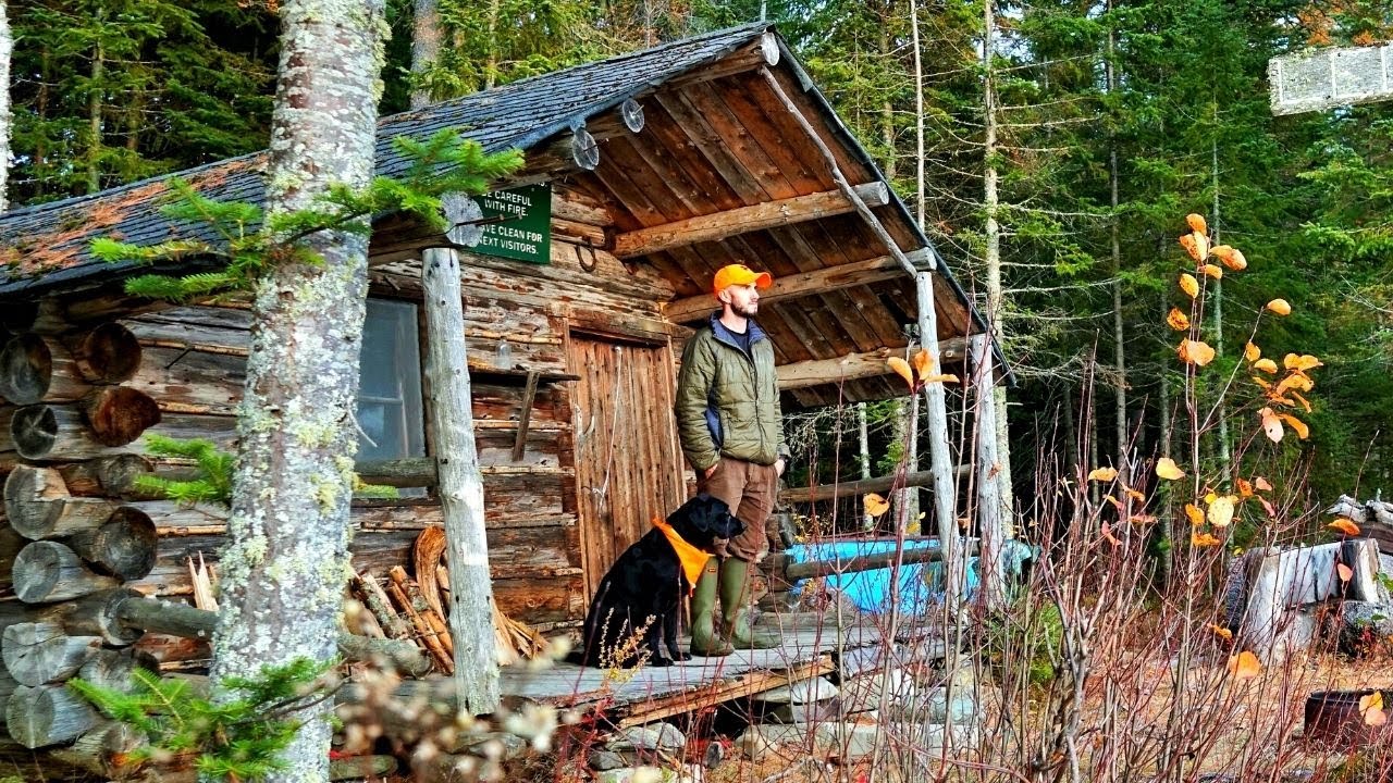 AN OLD LOG CABIN ON THE RIVER IN THE MAINE WOODS | St John River, North Maine Woods