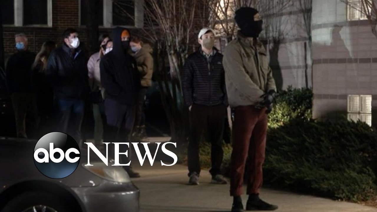 Georgians line up to vote in Senate runoff election