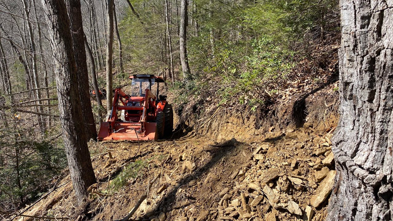 Finishing the hillside road!