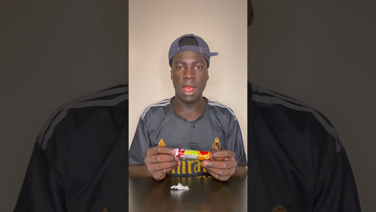 Black man eats life saver gummies for the first time