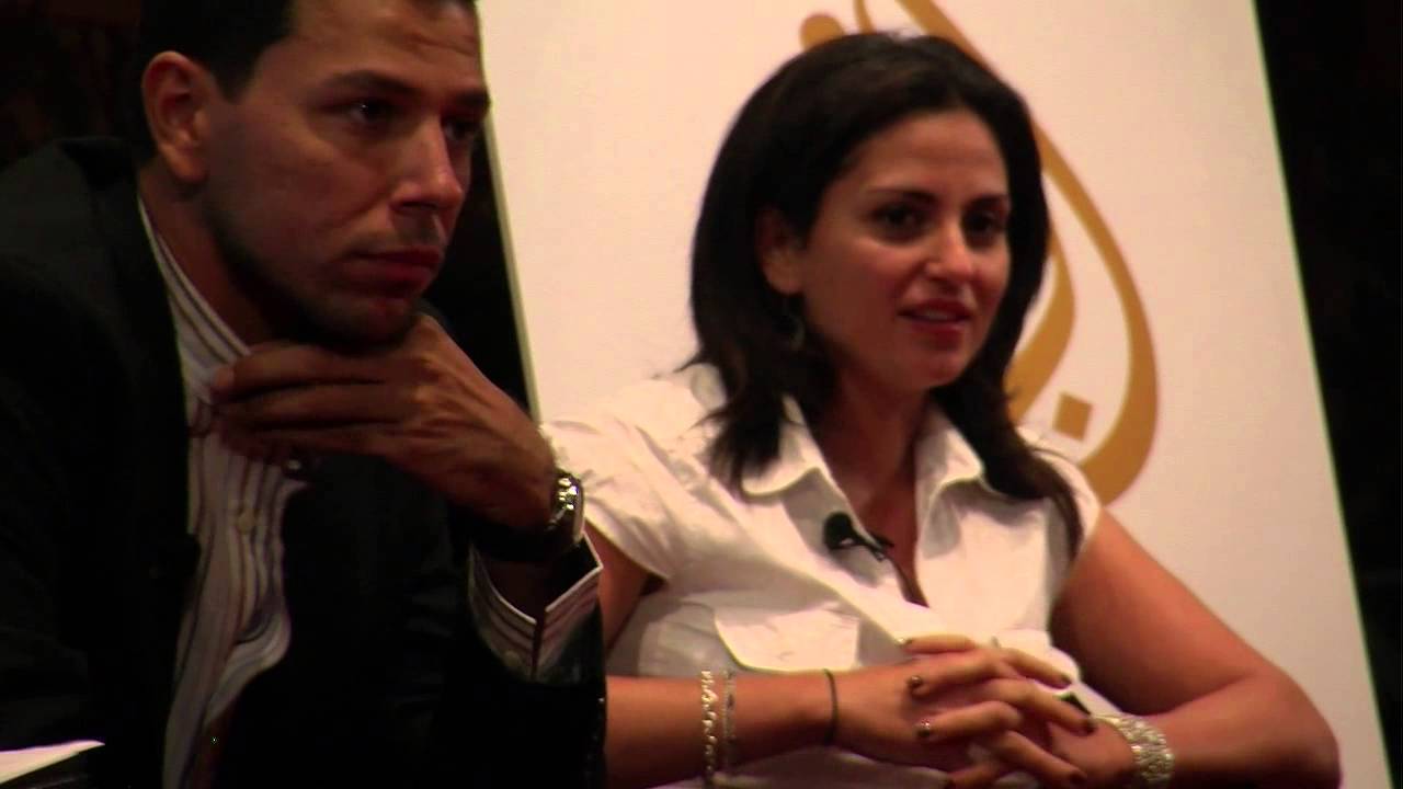 Ayman Mohyeldin and Sherine Tadros speaking at Georgetown University