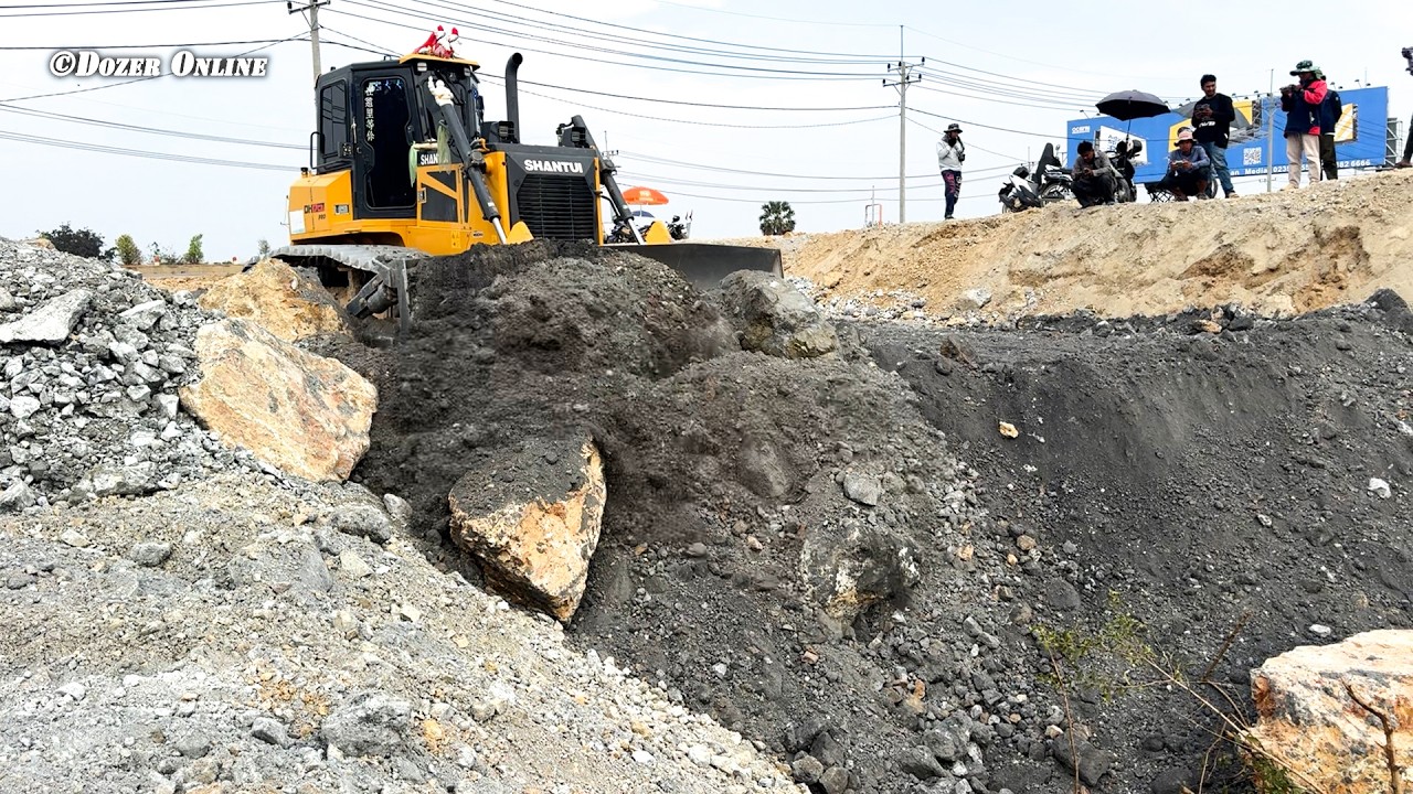 Nice Work Dozer Pushing Stone And Dump trucks unloading Stone