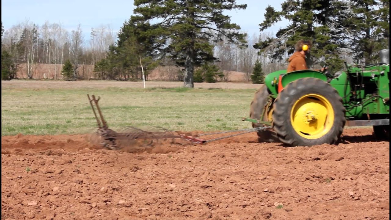 John Deere 1010 Harrowing